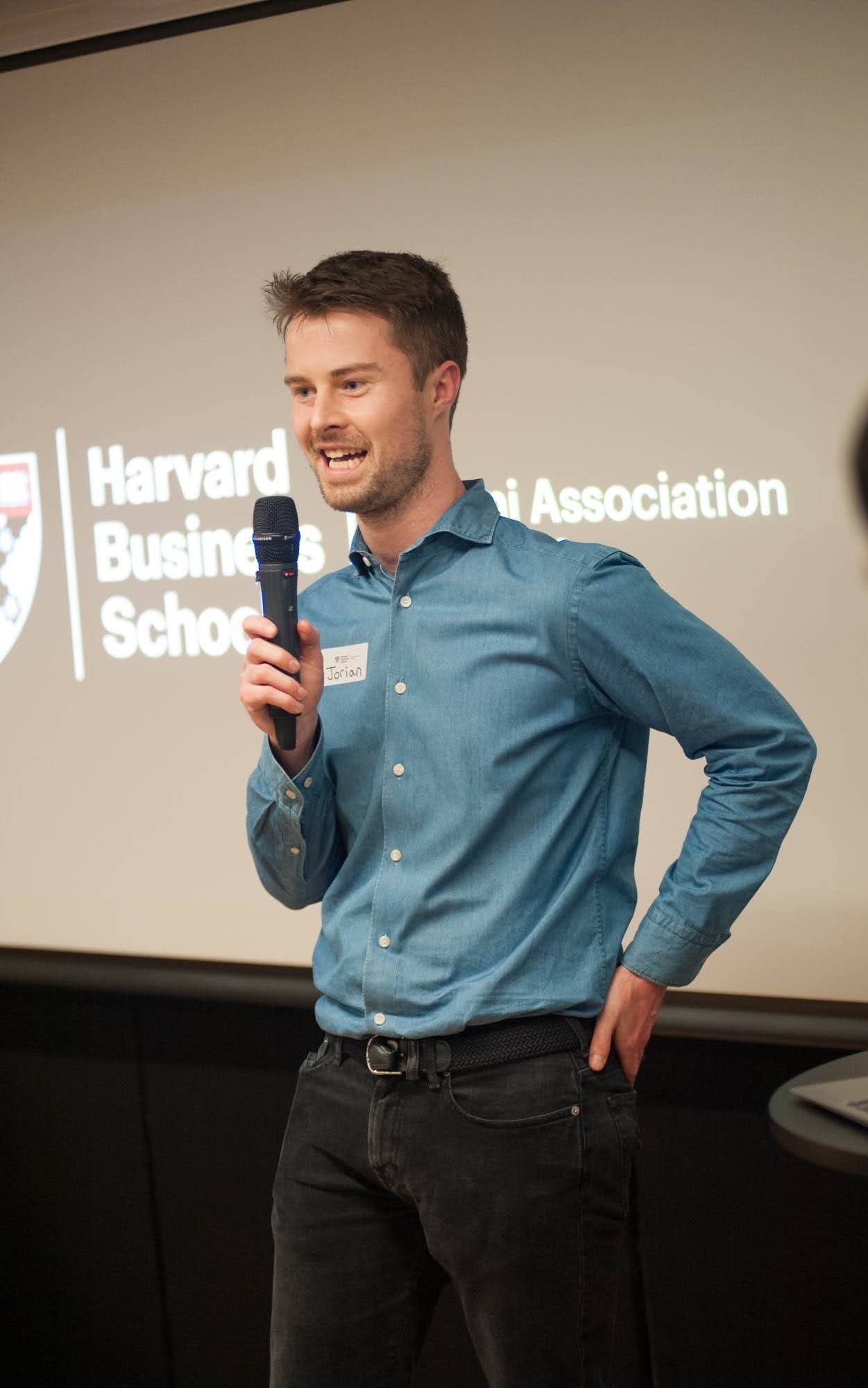 Jorian Hoover speaking at a Harvard Business School event